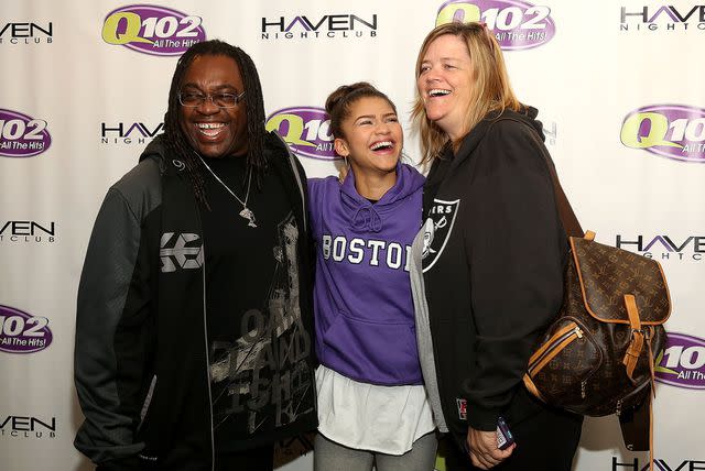 <p>Getty Images</p> Zendaya poses with father Kazembe Ajamu Coleman (left) and mother Claire Stoermer (right) at the Q102 Performance Theater Oct. 17, 2013, in Bala Cynwyd, Pa.