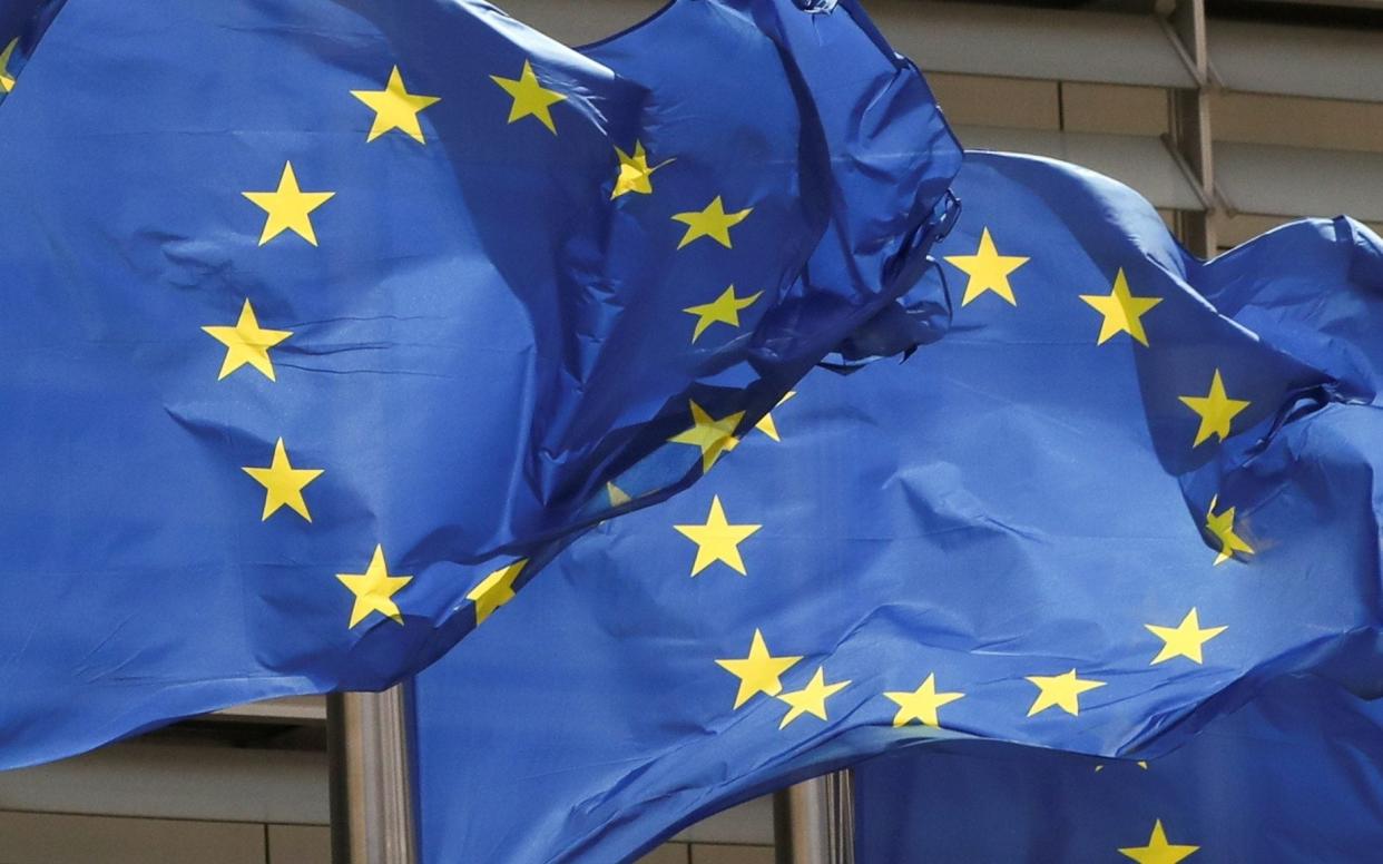 European Union flags flutter outside the EU Commission headquarters in Brussels