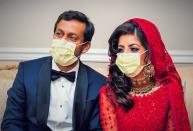 ldDoctors Kashif Chaudhry and Naila Shereen wear face masks after their wedding in New Windsor