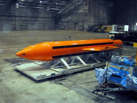 A Massive Ordnance Air Blast (MOAB) weapon is prepared for testing at the Eglin Air Force Armament Center March 11, 2003. REUTERS/Stringer/Files