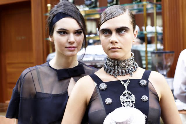 <p>Antonello Trio/Getty Images</p> Kendall Jenner and Cara Delevingne in 2015.