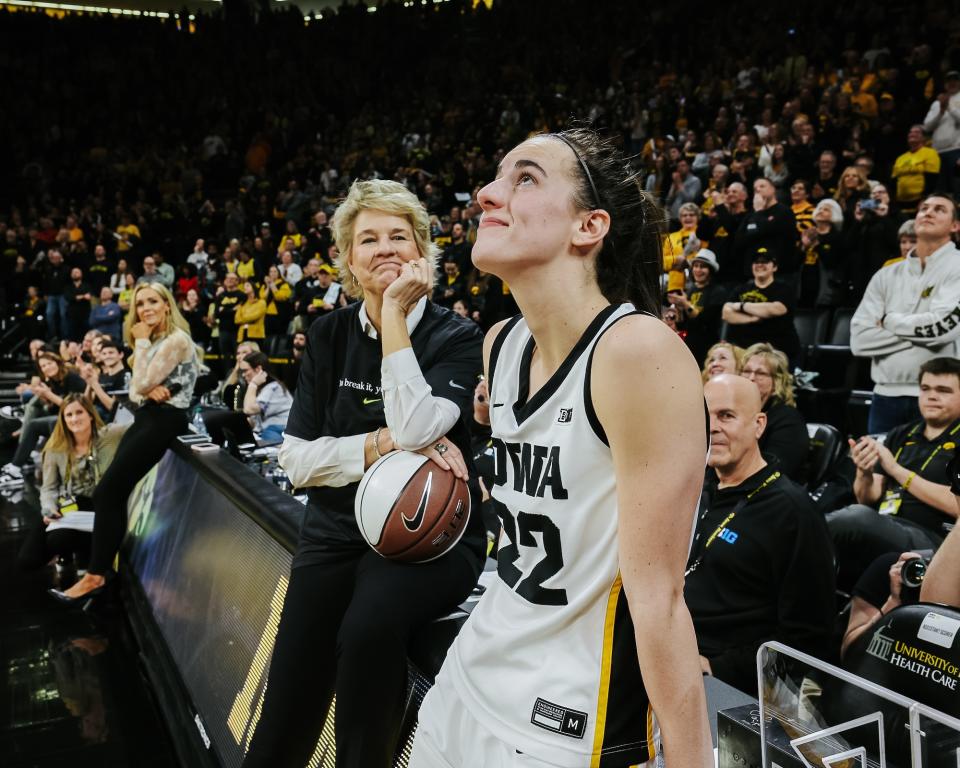 Clark and Bluder watching a video the team put together. (Iowa Athletics)