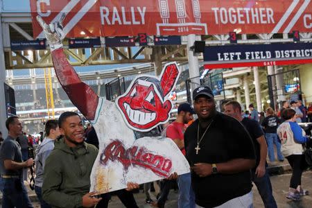 Fans of the American League baseball team Cleveland Indians hold a sign outside Progressive Field before Game 7 of the Major League Baseball World Series game against National League's Chicago Cubs in Cleveland, Ohio, U.S., November 2, 2016. REUTERS/Shannon Stapleton