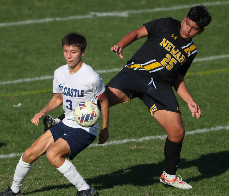 Delcastle's Alan Guzman Orozco (left) and Newark's Andrei Gutierrez-Lopez work near midfield in the first half of Delcastle's 1-0 overtime win, Tuesday, Oct. 3, 2023 at Newark.