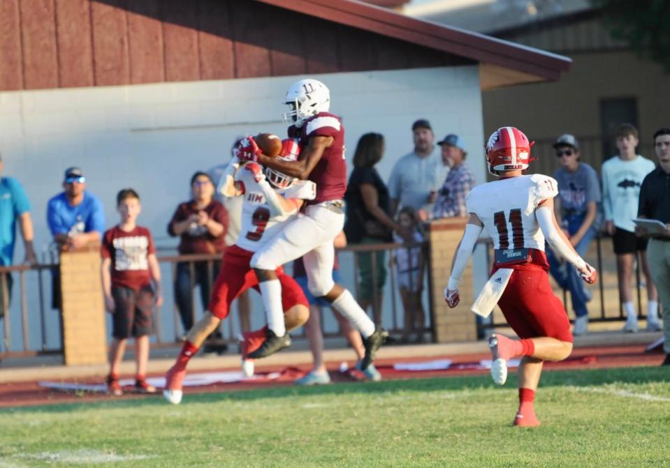 Hawley's Diontay Ramon catches a deep ball while defended by Jim Ned's Cooper Mascorro last season in Hawley.