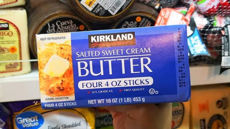 Holding a box of Kirkland salted butter