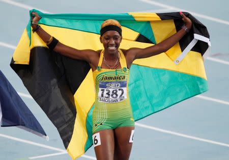 Janieve Russell of Jamaica celebrates winning the 400 m hurdles final at the IAAF World Junior Championships at Lluis Company Olympic stadium in Barcelona in this July 14, 2012 file photo. REUTERS/Gustau Nacarino