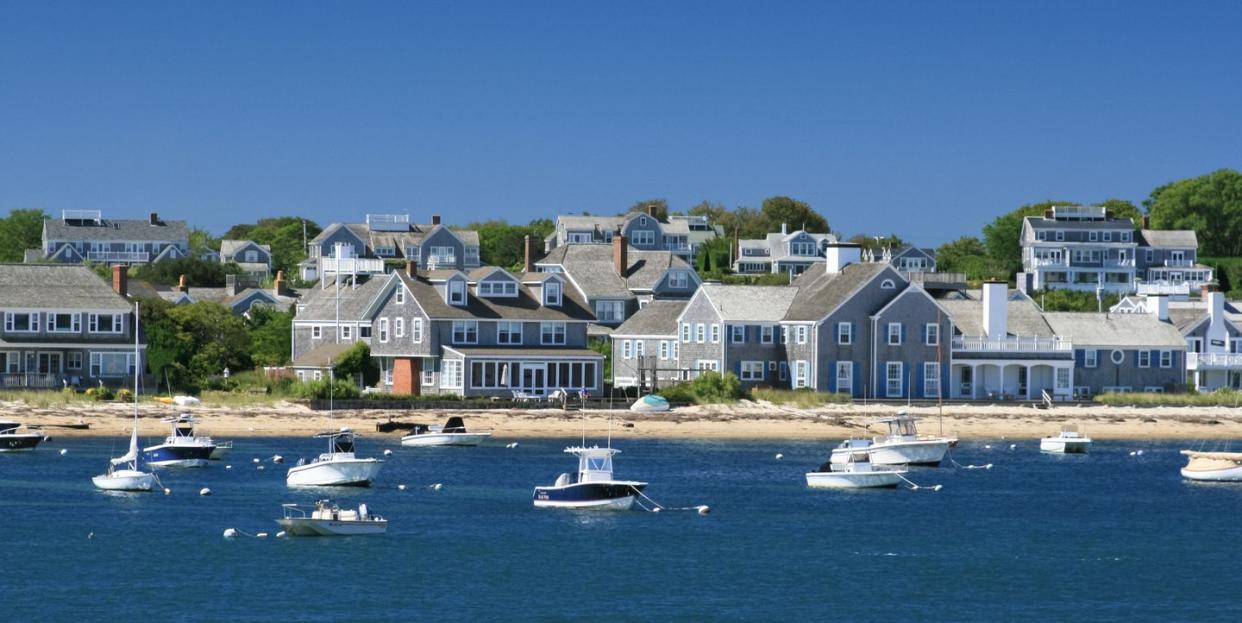 boats and waterfront houses, nantucket, massachusetts clear blue sky