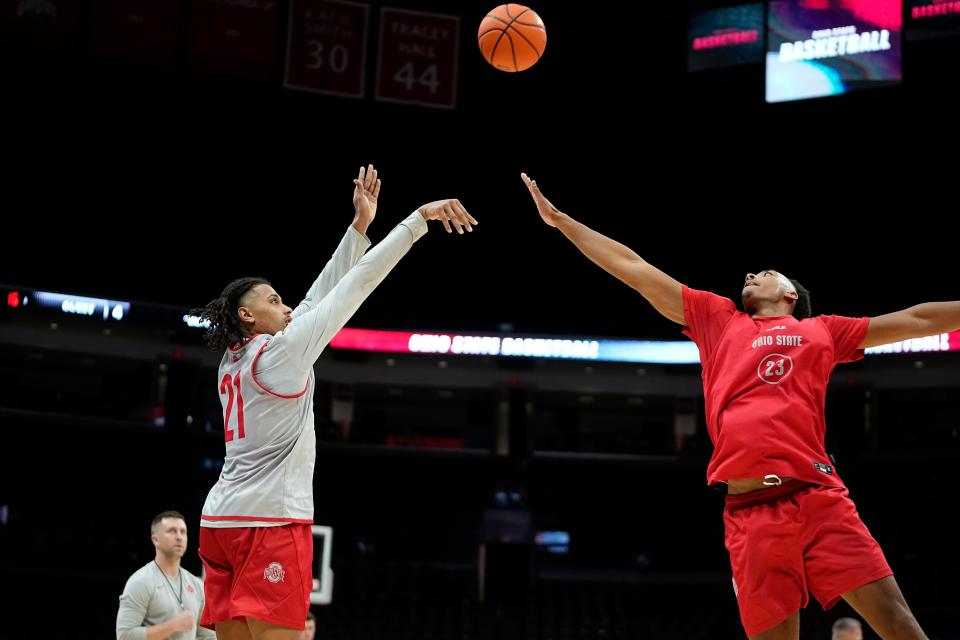 Oct 19, 2023; Columbus, Ohio, USA; Ohio State Buckeyes forward Devin Royal (21) shoots over forward Zed Key (23) during an open practice at Value City Arena.