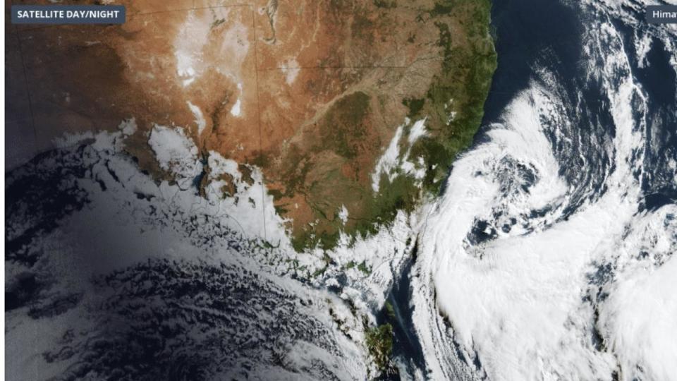 A low pressure system is spinning over the Tasman Sea on Monday bringing with it a wintry mix of rain, snow, hail, blustery winds and large waves in parts of southeastern Australia.