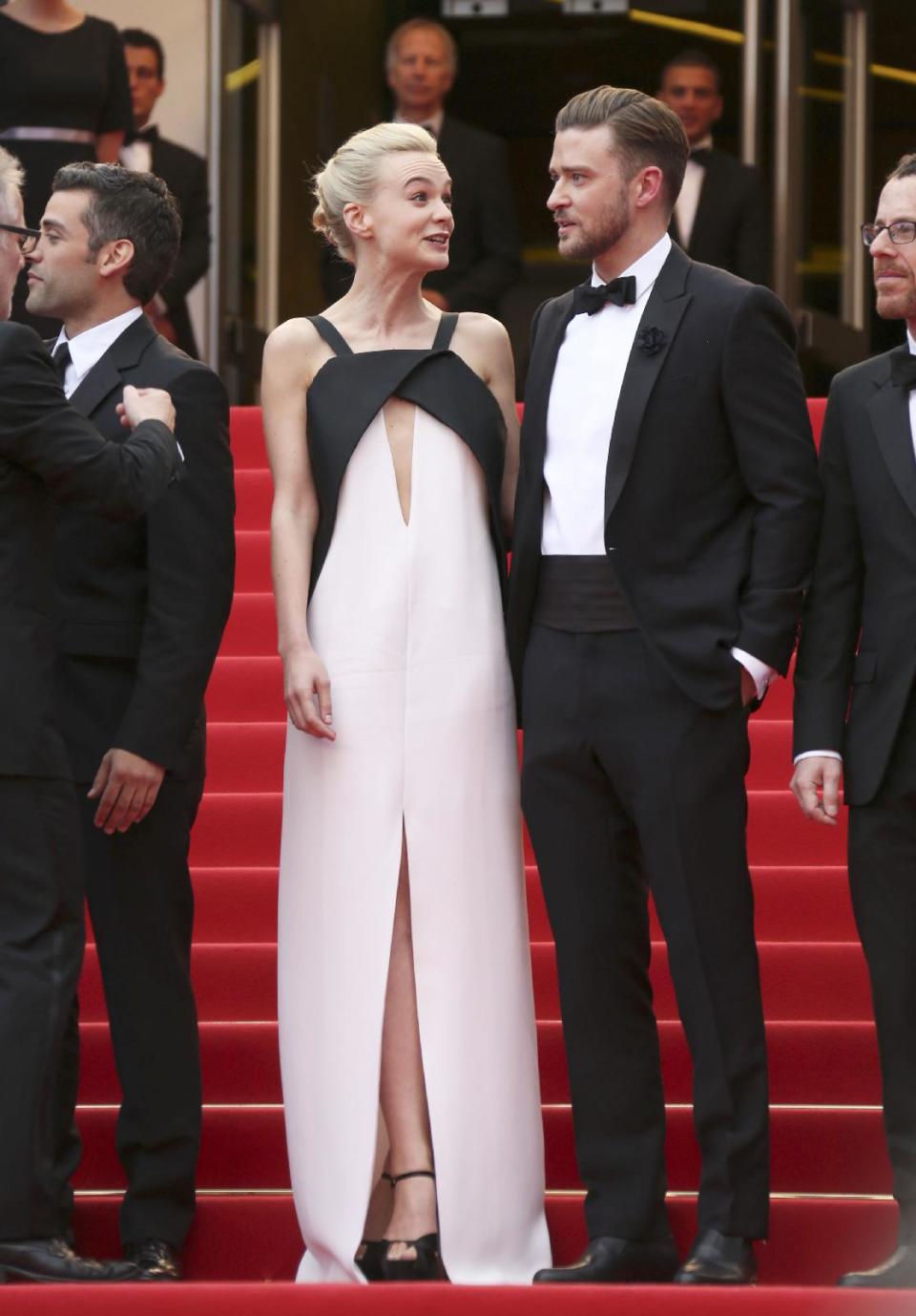 FILE - This May 19, 2013 file photo shows actress Carey Mulligan, left, in a Deco-inspired white and black gown with keyhole opening with Justin Timberlake at the screening of "Inside Llewyn Davis" at the 66th international film festival, in Cannes, southern France. (Photo by Joel Ryan/Invision/AP, file)