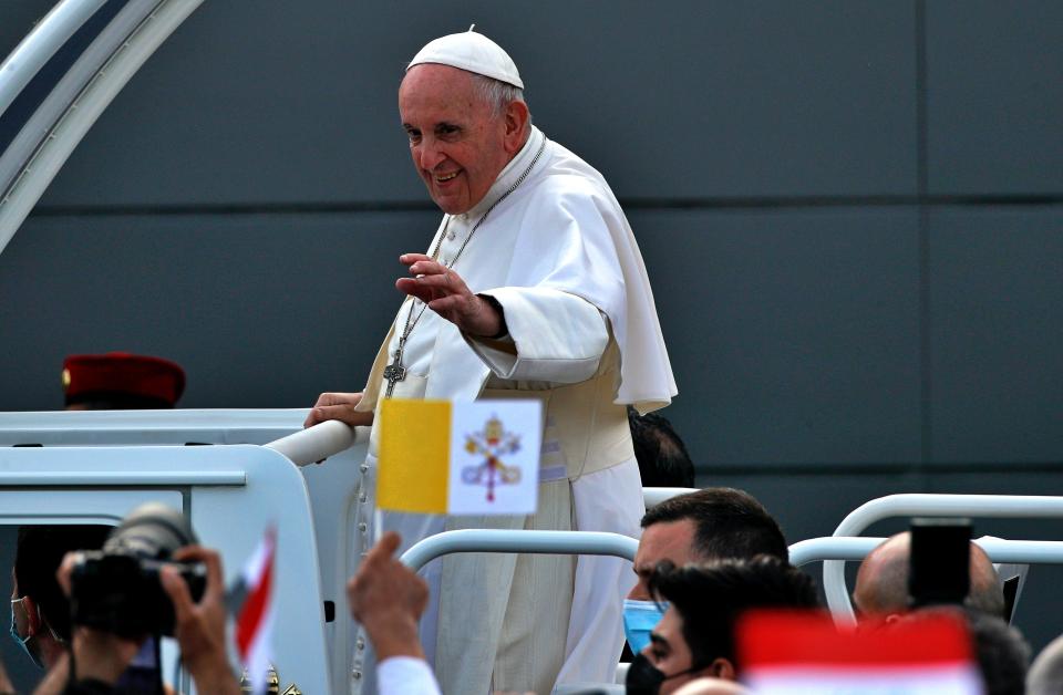 Pope Francis waves to faithful as he arrives for an open air Mass at a stadium in Irbil, Iraq, Sunday, March 7, 2021. Thousands of people filled the sports stadium in the northern city of Irbil for Francis’ final event in his visit to Iraq: an open-air Mass featuring a statue of the Virgin Mary that was restored after Islamic militants chopped of the head and hands. (AP Photo/Hadi Mizban)