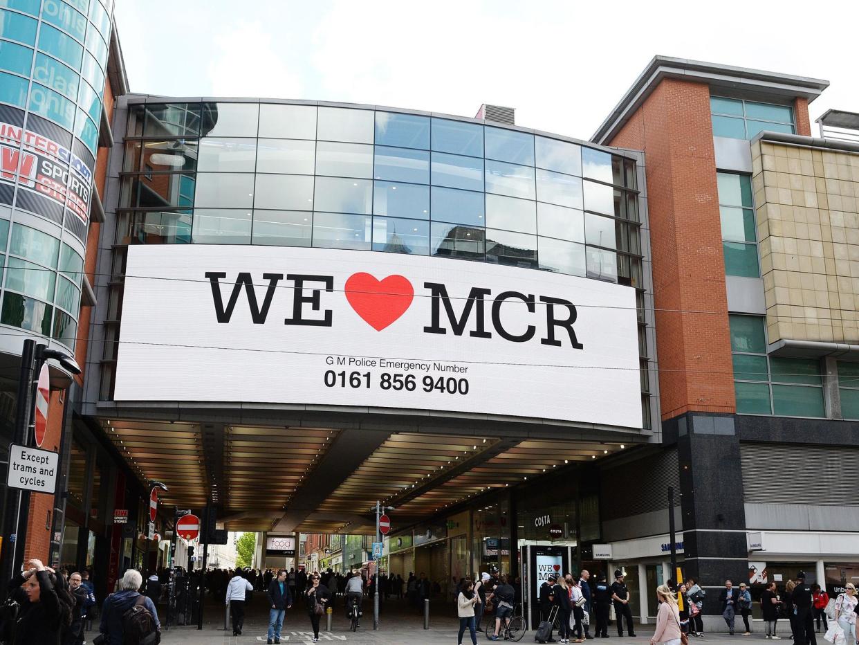 Banners with the message "We Love MCR" are being displayed across the city after last night's atrocity: PA