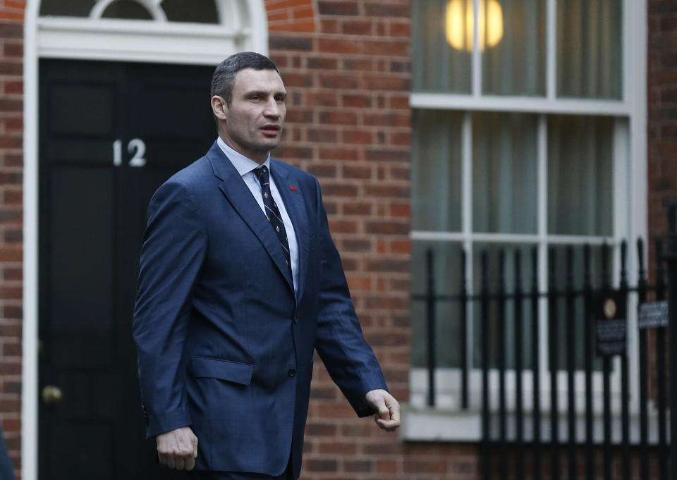 Ukrainian parliamentarian Vitali Klitschko, leader of the UDAR (Ukrainian Democratic Alliance for Reform) party, arrives at 10 Downing Street for a meeting with British Prime Minister David Cameron and British Foreign Secretary William Hague, London, Wednesday, March 26, 2014. (AP Photo/Sang Tan)
