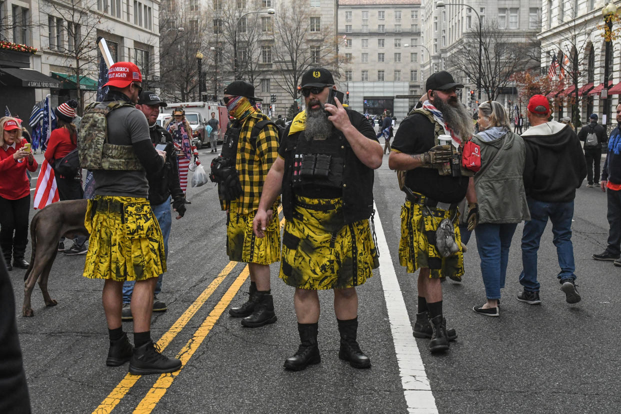 WASHINGTON, DC - DECEMBER 12: Members of the Proud Boys, wearing kilts, gather outside of Harry's bar during a protest on December 12, 2020 in Washington, DC. Thousands of protesters who refuse to accept that President-elect Joe Biden won the election are rallying ahead of the electoral college vote to make Trump's 306-to-232 loss official. (Photo by Stephanie Keith/Getty Images)