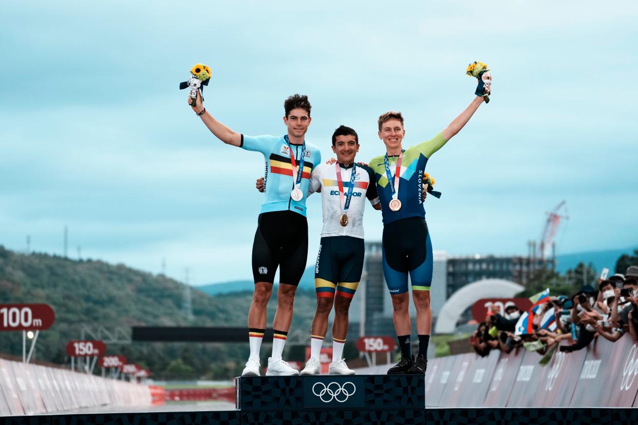 Wout van Aert, Richard Carapaz and Tadej Pogacar on the podium (AP)