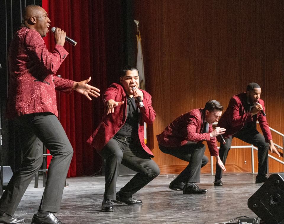 The suits, Tim Brown, Dennis Diaz, Luke Monday and Victor Solomon, harmonize at their Feb. 4, 2024, PS Concerts performance.