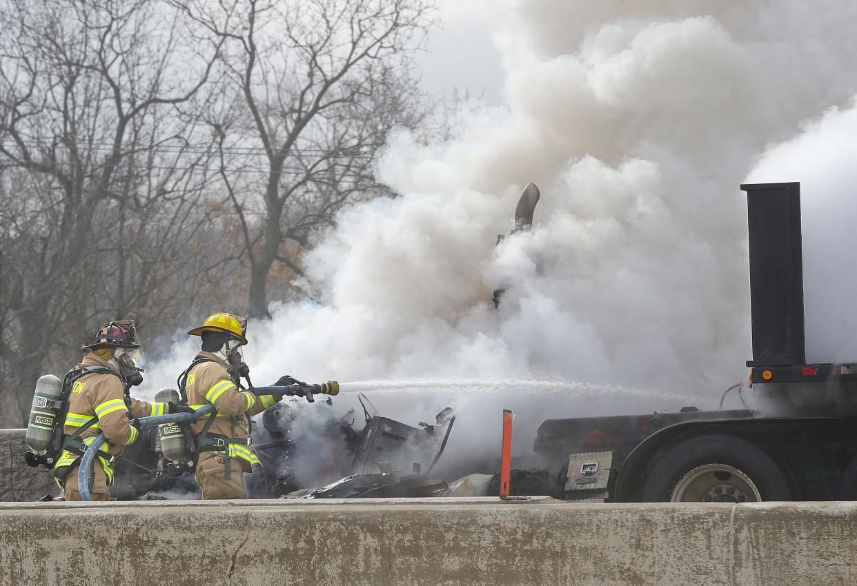 Barberton firefighters battle a tractor trailer fire Monday on Interstate 76 East near Wooster Road North.