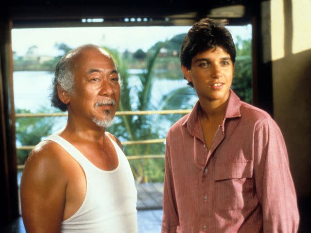 <p>Columbia Pictures/Getty</p> Pat Morita and Ralph Macchio in 'The Karate Kid'