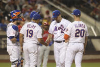 New York Mets manager Luis Rojas (19) pulls pitcher Rich Hill, second from right, during the fifth inning of a baseball game against the Philadelphia Phillies, Sunday, Sept. 19, 2021, in New York. (AP Photo/Jason DeCrow)