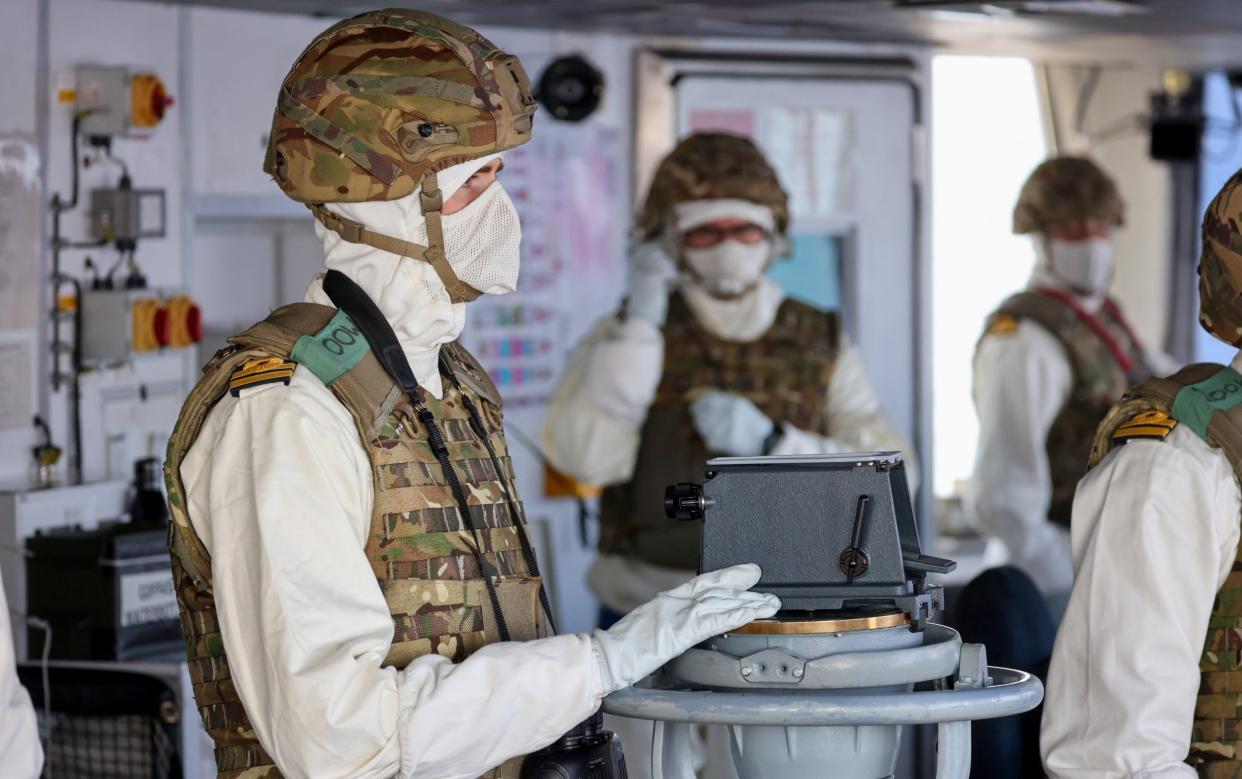 The Officer of the Watch is seen here on the bridge of HMS Diamond in the Red Sea