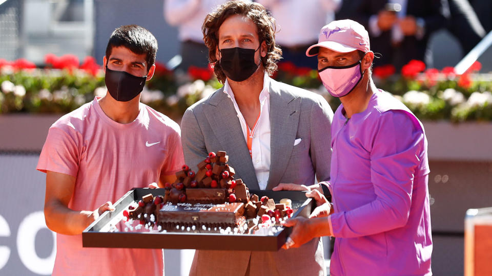 Feliciano Lopez and Rafael Nadal, pictured here presenting a birthdate cake to Carlos Alcaraz.