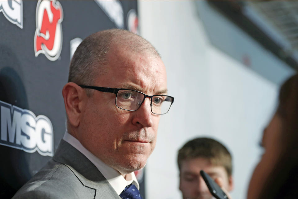 New Jersey Devils interim general manager Tom Fitzgerald anwers reporters' questions after the Devils announced that captain Andy Greene was traded to the New York Islanders, Sunday, Feb. 16, 2020, before an NHL hockey game in Newark, N.J. Greene had been a member of the Devils for his entire 14-year pro career and served as the team captain for the past five seasons. (AP Photo/Kathy Willens)