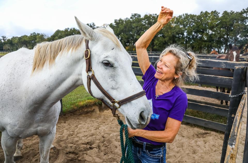 Gail Rice, of Magic Oaks Farm in Citra, tries to get her 11-year-old horse, Triple Cross, to raise his ears on Dec. 7. Rice bred Medina Spirit and talked about the horse at her farm that day. "It was a shock, but it does happen," Rice said of Medina Spirit's death.