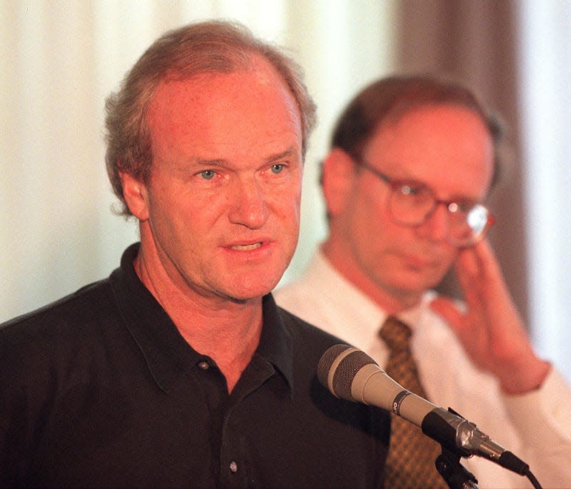  Mike Barnicle with Matt Storin, editor, in background at The Boston Globe press conference.