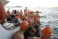 Swimmers with the Dolphin Club wait for the signal to jump into San Francisco Bay near Alcatraz Island during the annual New Year's Day swim to Aquatic Park in San Francisco, California January 1, 2015. REUTERS/Stephen Lam (UNITED STATES - Tags: ANNIVERSARY SOCIETY)