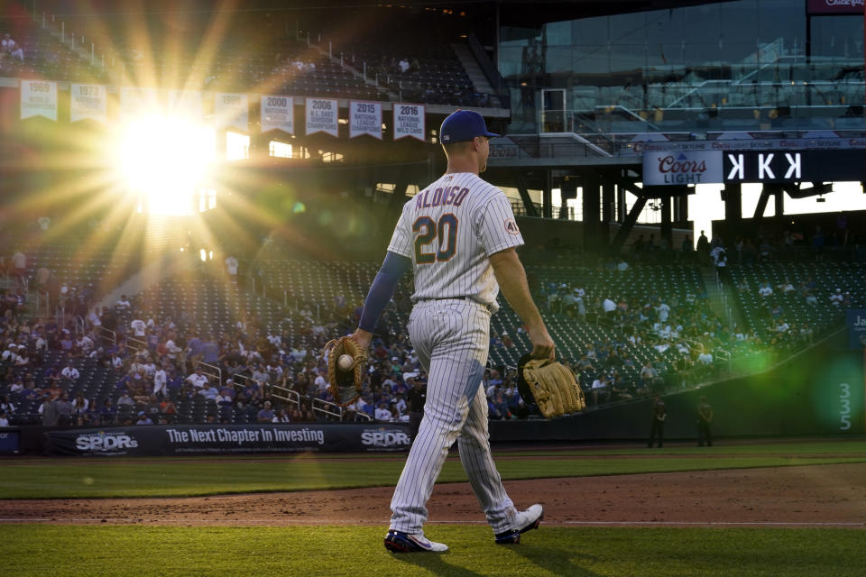 New York Mets first baseman Pete Alonso walks to his position between innings of the team's baseball game against the Chicago Cubs on June 17, 2021, in New York. (AP Photo/Kathy Willens)