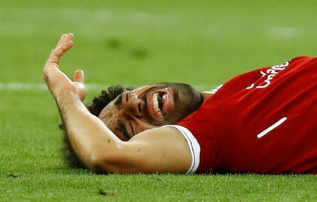 Soccer Football - Champions League Final - Real Madrid v Liverpool - NSC Olympic Stadium, Kiev, Ukraine - May 26, 2018 Liverpool's Mohamed Salah reacts after sustaining an injury REUTERS/Kai Pfaffenbach