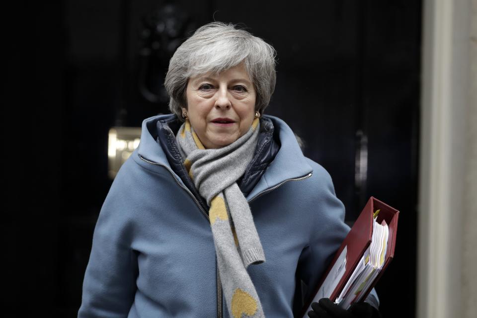 Britain's Prime Minister Theresa May leaves from Downing Street in London, Wednesday, March 13, 2019. European Union officials on Wednesday criticized the U.K. Parliament for rejecting a Brexit deal for a second time as the bloc prepared for a chaotic, cliff-edge departure. (AP Photo/Matt Dunham)