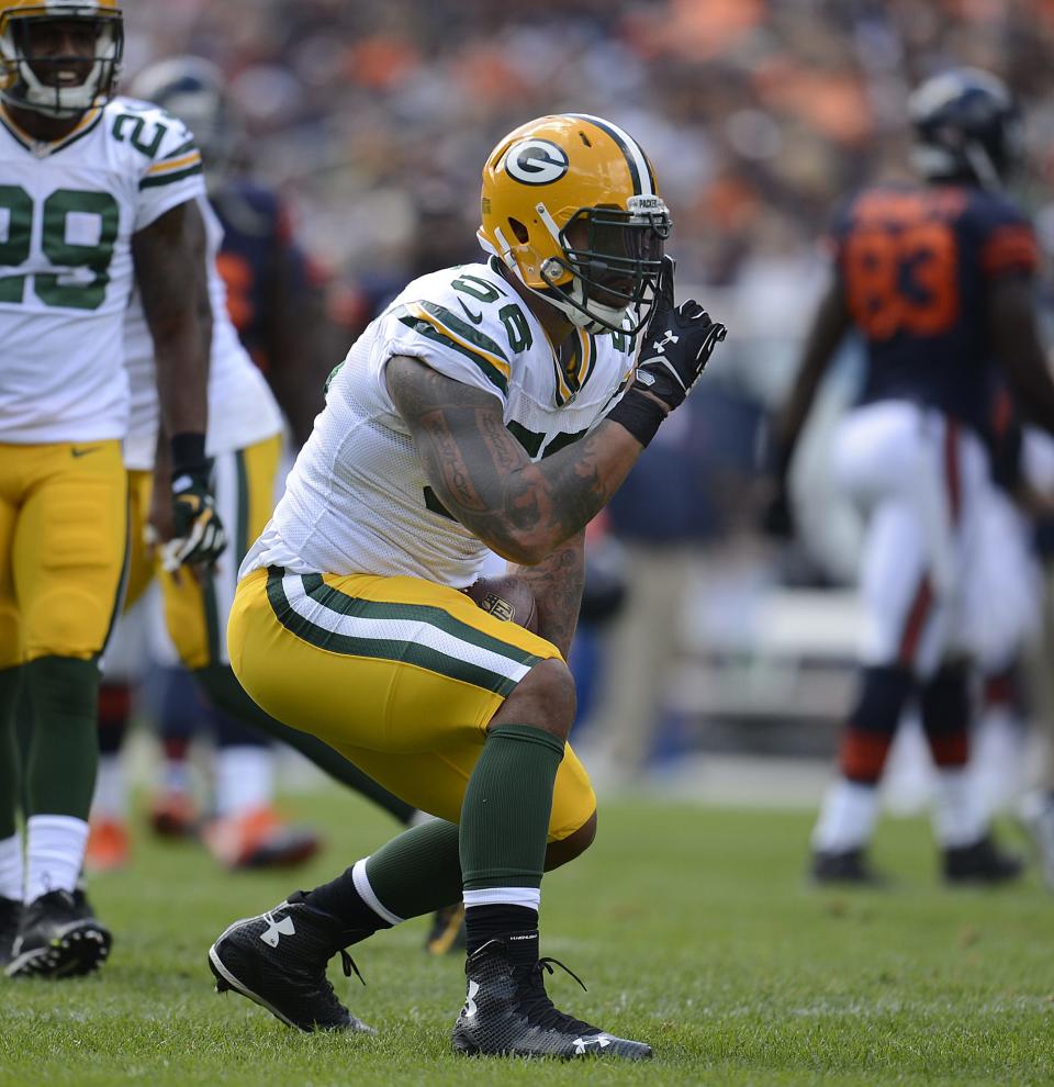 Green Bay Packers linebacker Julius Peppers (56) celebrates after sacking Chicago Bears quarterback Jay Cutler during a game on Sept. 13, 2015, at Soldier Field in Chicago.