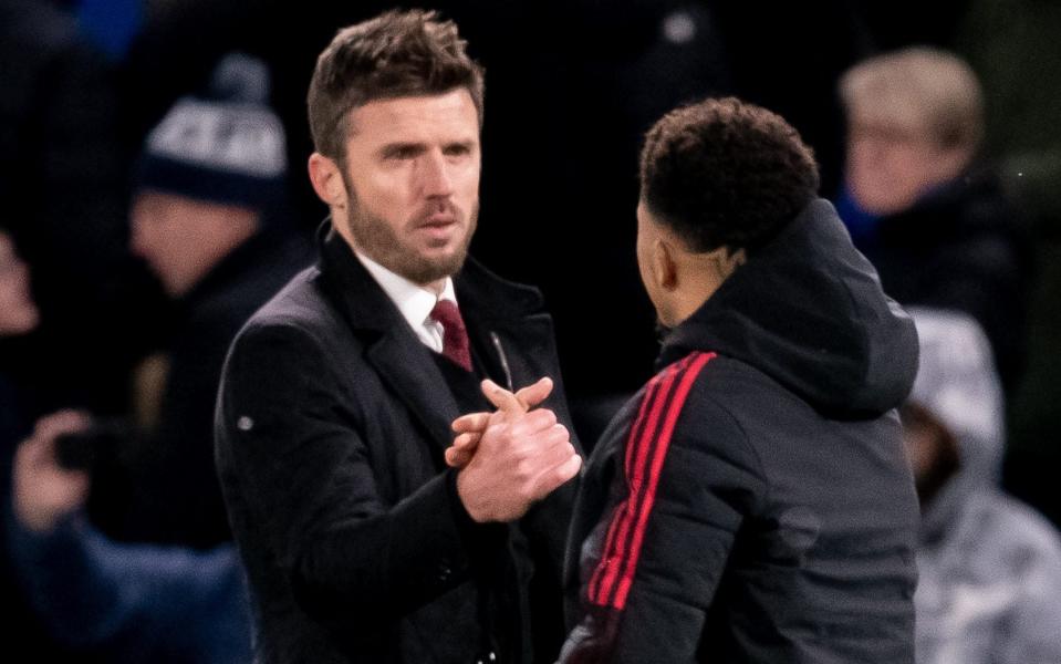 Michael Carrick and Jadon Sancho - - GETTY IMAGES