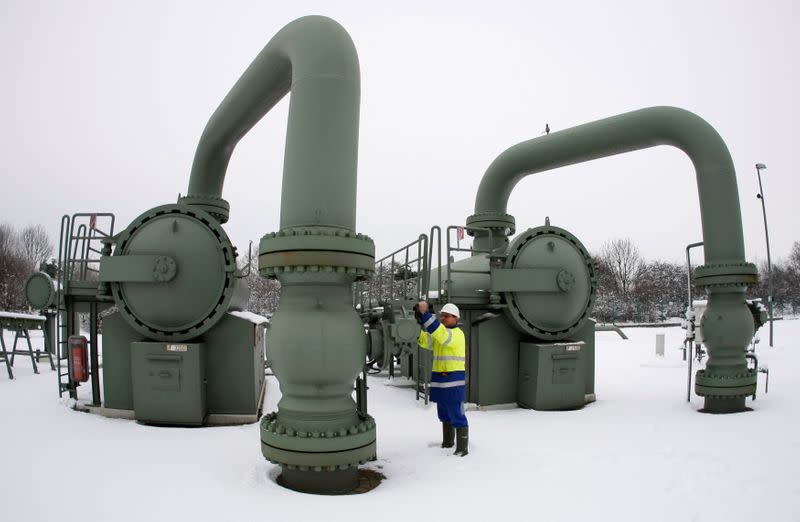 FILE PHOTO: A technician of RWE controls a compressor station in the western town of Huenxe