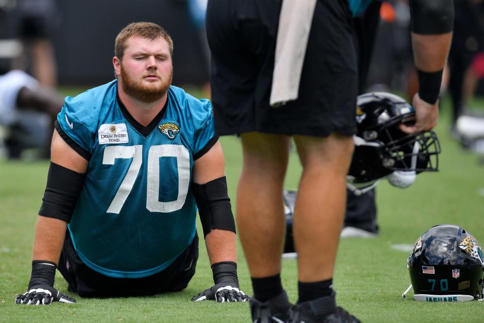 Jacksonville Jaguars offensive tackle Cole Van Lanen (70) stretches during warmups at day two of the Jacksonville Jaguars three day rookie minicamp at TIAA Bank Field in Jacksonville, FL Tuesday, June 13, 2023.