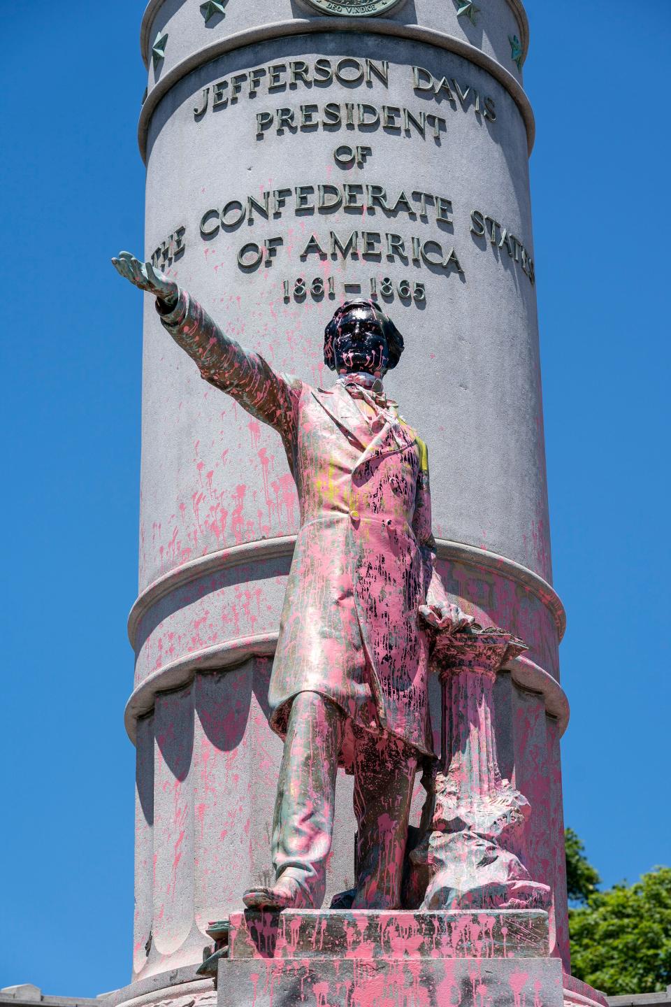 Paint and protest graffiti covers the Jefferson Davis Memorial in Richmond, Va., June 7, 2020, following a week of unrest in the U.S. against police brutality and racism in policing. Jefferson Davis was the president of the Confederate States of America during the Civil War.