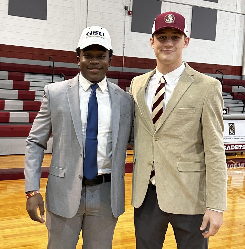Benedictine football teammates Luke Kromenhoek (right) and Bryce Baker signed to play at Florida State and Georgia Southern Wednesday.