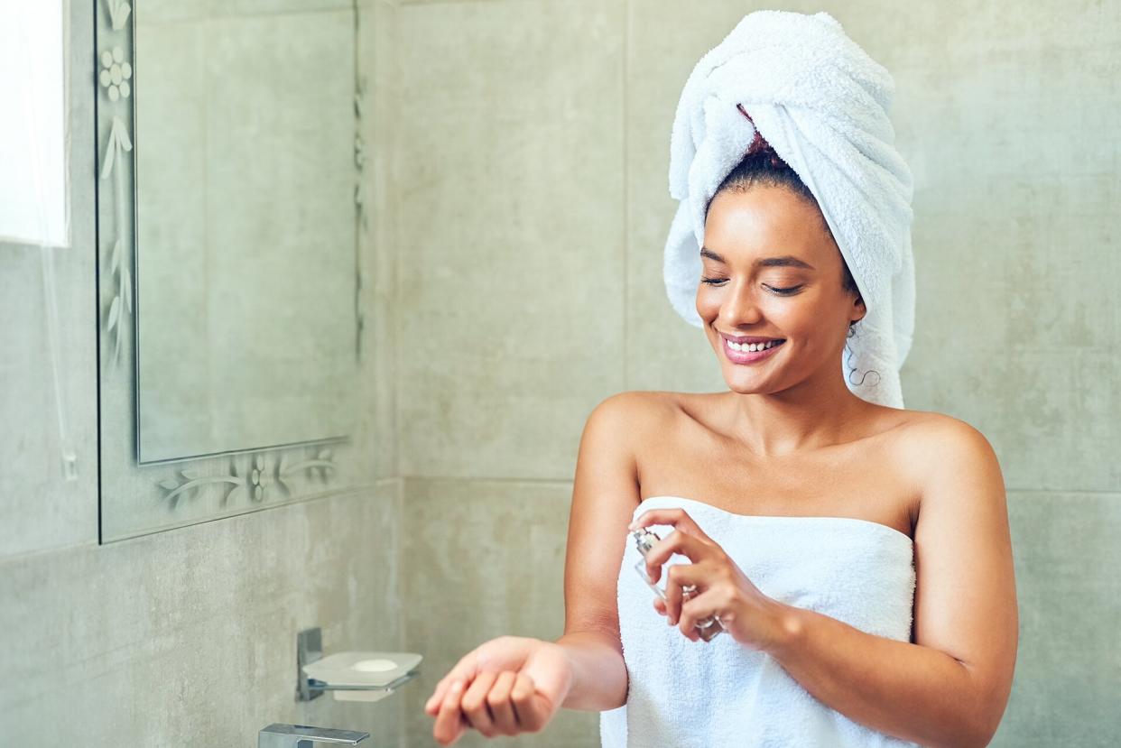 woman applying perfume