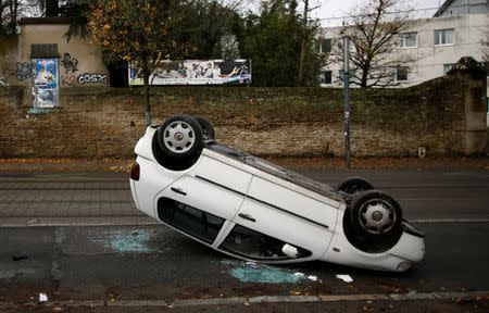 A car that was vandalized by students is seen on a street near a technical school in Nantes, France, December 4, 2018. REUTERS/Stephane Mahe