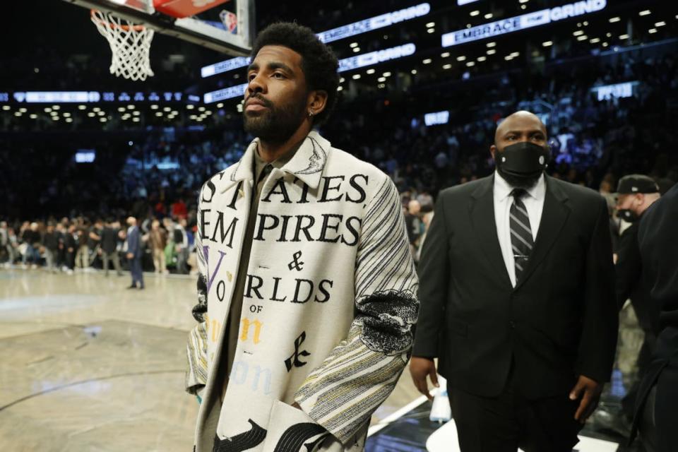 <div class="inline-image__caption"><p>Kyrie Irving of the Brooklyn Nets attends the first half against the New York Knicks at Barclays Center on March 13, 2022, in the Brooklyn borough of New York City. Irving did not play because he refused to be vaccinated against COVID-19.</p></div> <div class="inline-image__credit">Sarah Stier/Getty</div>
