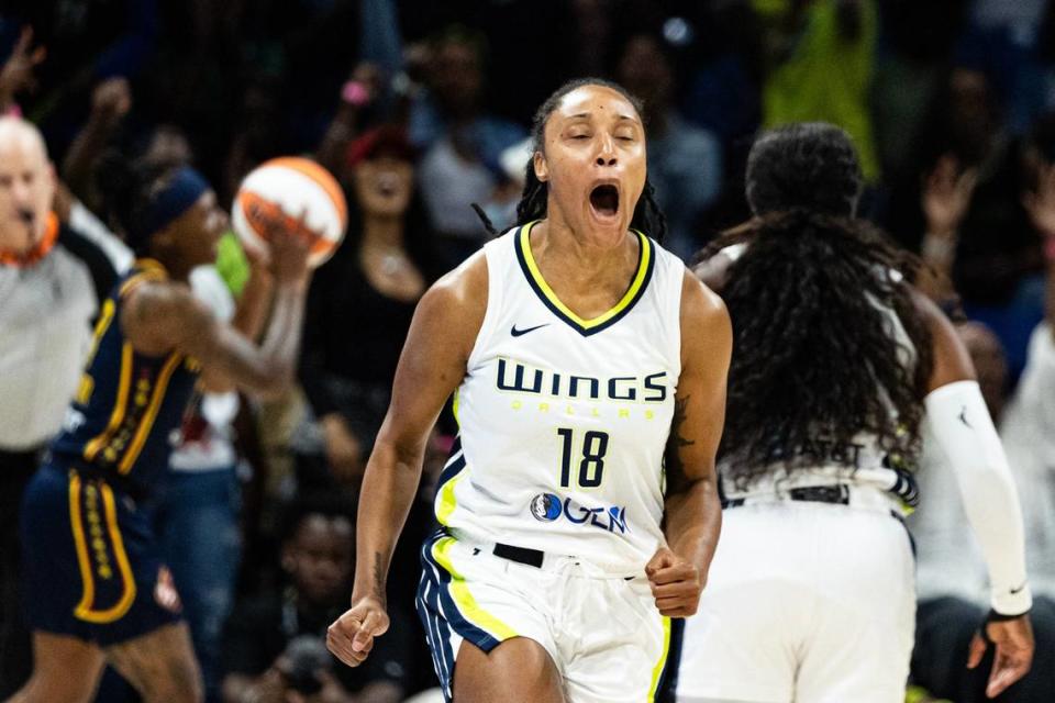 Dallas Wings guard Jaelyn Brown (18) celebrates after hitting a three-point shot in the first quarter of a WNBA preseason game at College Park Center in Arlington on Friday, May 3, 2024.