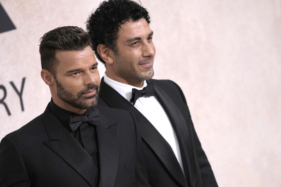 Ricky Martin, left, and Jwan Yosef pose for photographers upon arrival at the amfAR Cinema Against AIDS benefit at the Hotel du Cap-Eden-Roc, during the 75th Cannes international film festival, Cap d'Antibes, southern France, Thursday, May 26, 2022. (Photo by Joel C Ryan/Invision/AP)