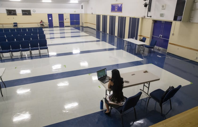 NORTHRIDGE, CA - AUGUST 18: Oliver Wendell Holmes Middle School principal Kim D'Aloisio hosts for a virtual meeting with staff socially distanced in the school auditorium to mark the beginning of the school year Tuesday, Aug. 18, 2020 in Northridge, CA. Brian van der Brug / Los Angeles Times)