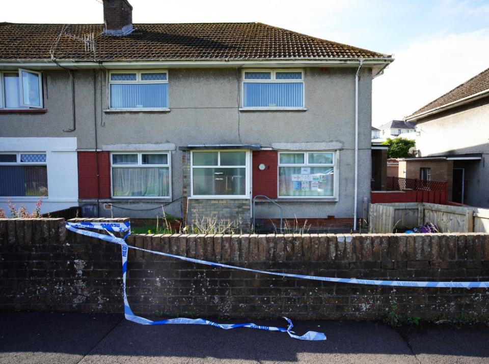 Police tape at a property in the Sarn area of Bridgend (PA) (PA Wire)