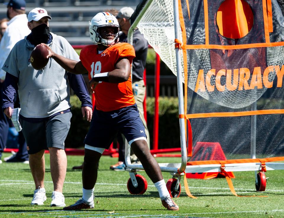 Auburn quarterback Dematrius Davis (18) runs drills during an open football practice at Jordan-Hare Stadium in Auburn, Ala., on Saturday, March 20, 2021.