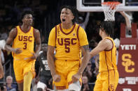 Southern California guard Boogie Ellis, center, celebrates after scoring during the first half of an NCAA college basketball game against Washington State Thursday, Feb. 2, 2023, in Los Angeles. (AP Photo/Mark J. Terrill)