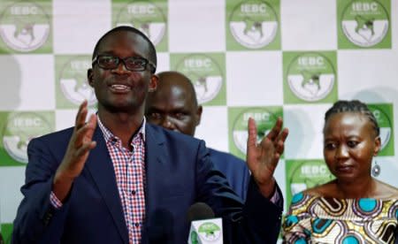 FILE PHOTO: Chief Electoral Officer of Kenya's Independent Electoral and Boundaries Commission (IEBC) Ezra Chiloba, flanked by chairman Wafula Chebukati and commissioner Roselyn Akombe, addresses a news conference at their offices in Nairobi, Kenya, July 6, 2017. REUTERS/Thomas Mukoya