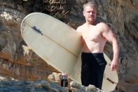 <p>Matt Damon gets some sun while surfing with a friend on Thursday in Malibu. </p>